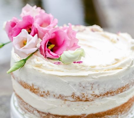 simple naked cake with fresh flowers